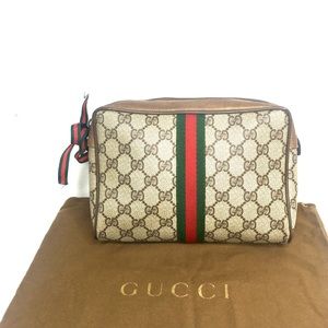 Authentic Gucci brown monogram canvas clutch bag